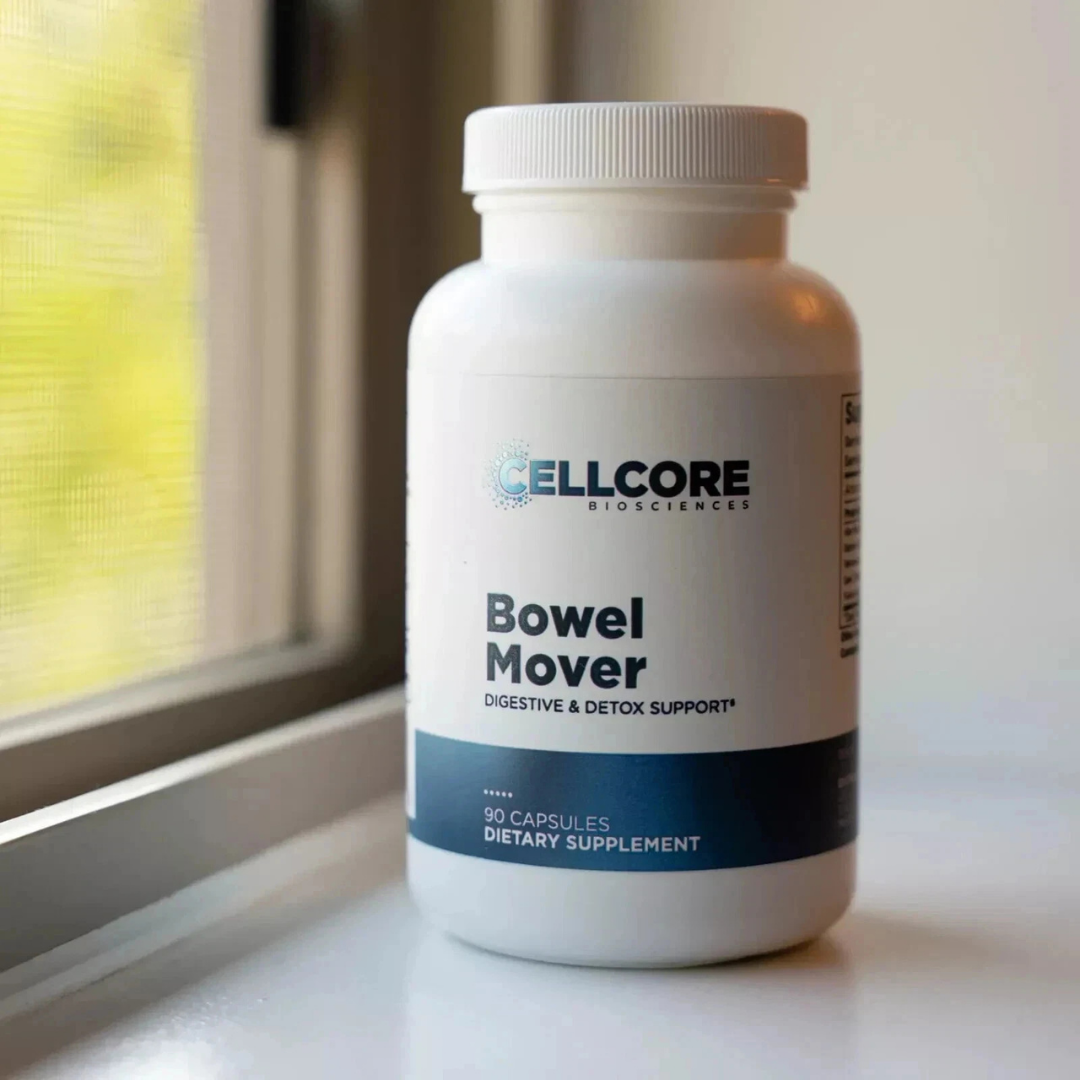 Supplement bottle labeled 'Bowel Mover' by Cellcore on a windowsill.